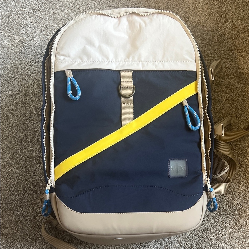 Stylish Beige and Navy Backpack with Yellow Detail